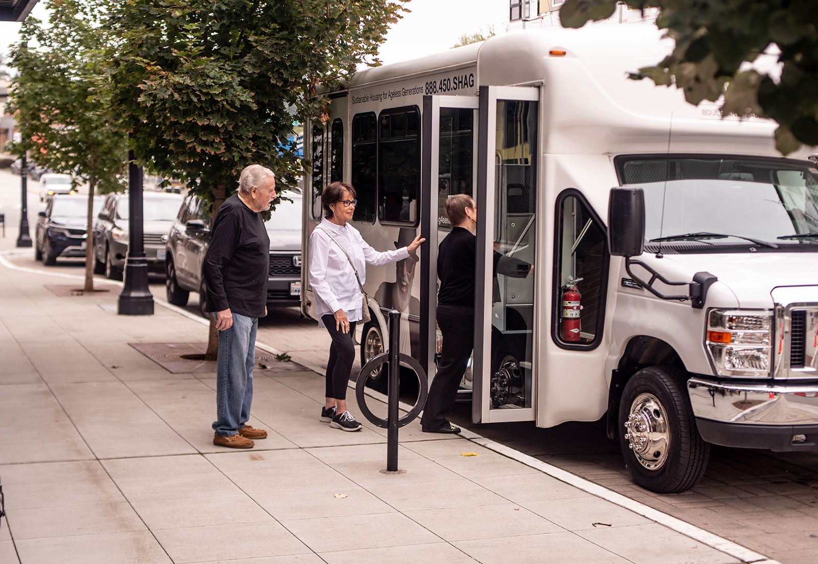 group of seniors walking on SHAG community van