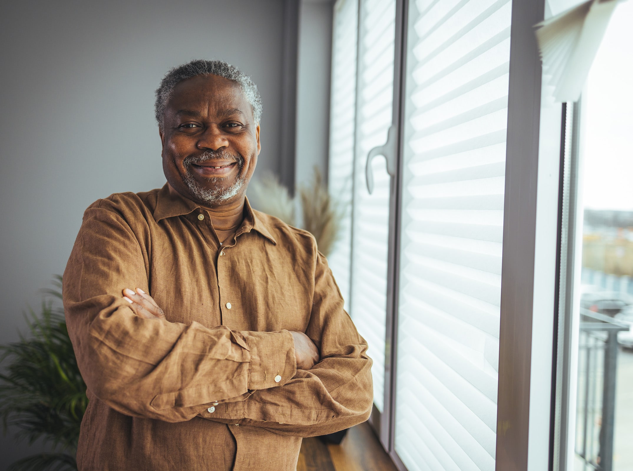 Man happy by the window